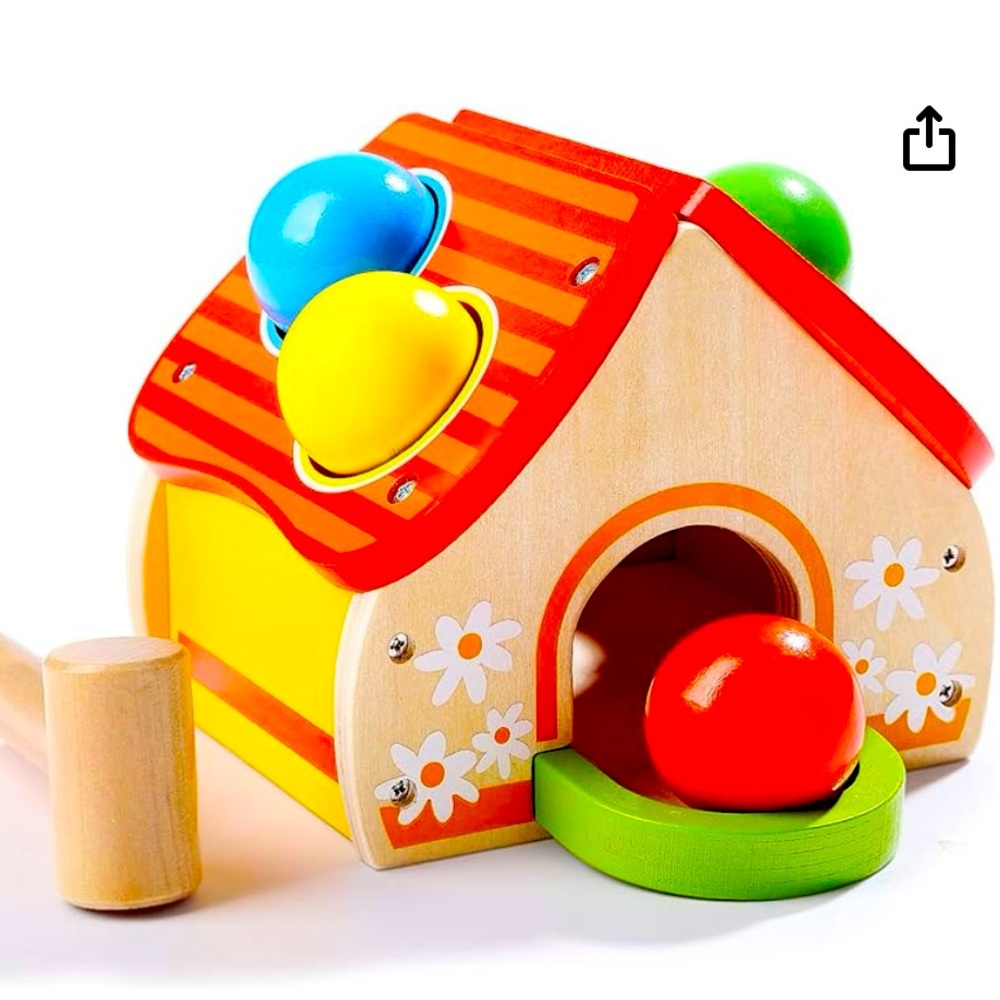 Top bright wooden hammer toy. Pounding bench toy for toddlers